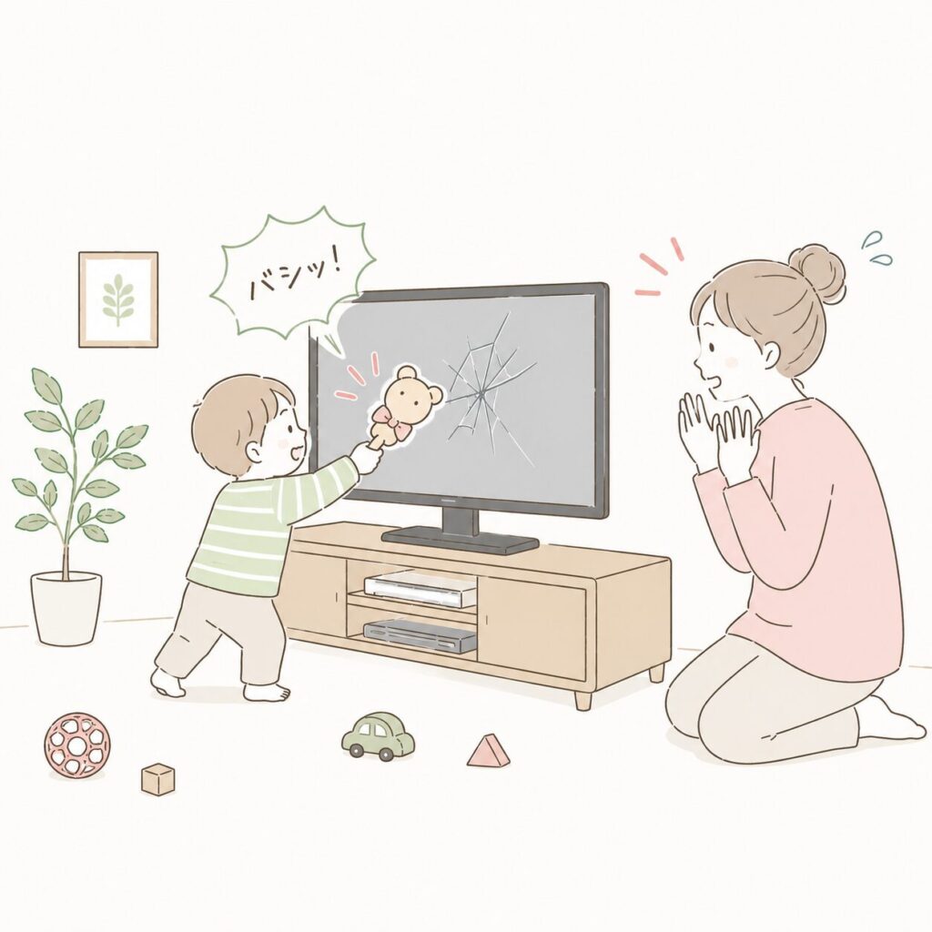 テレビをおもちゃで叩く子ども